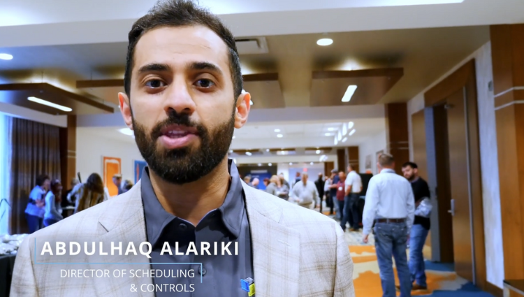 Screenshot of a Director of Scheduling and Controls, Abdul, from a video